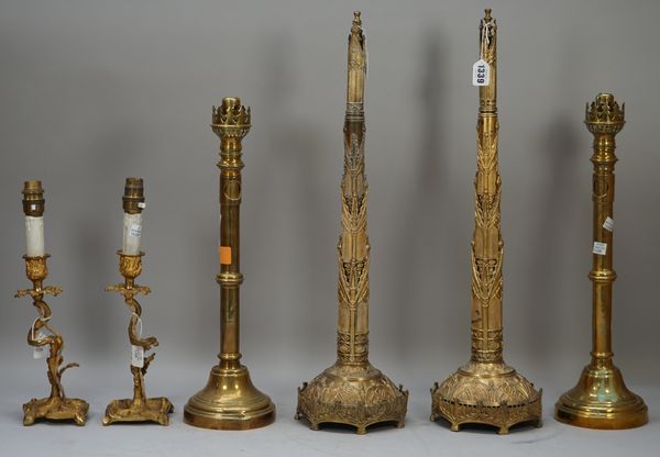 A pair of early 19th century Day's patent brass chimney ornaments of gothic form with paper trade label to base, 58cm high, a pair of Victorian brass