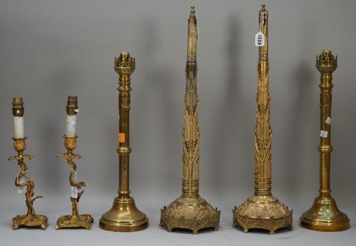 A pair of early 19th century Day's patent brass chimney ornaments of gothic form with paper trade label to base, 58cm high, a pair of Victorian brass