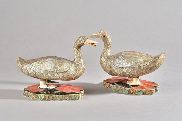 A pair of 19th century Chinese mother-of-pearl and ivory duck form box and covers, each with a small disguised cover inscribed "Qianlong yu wan", the