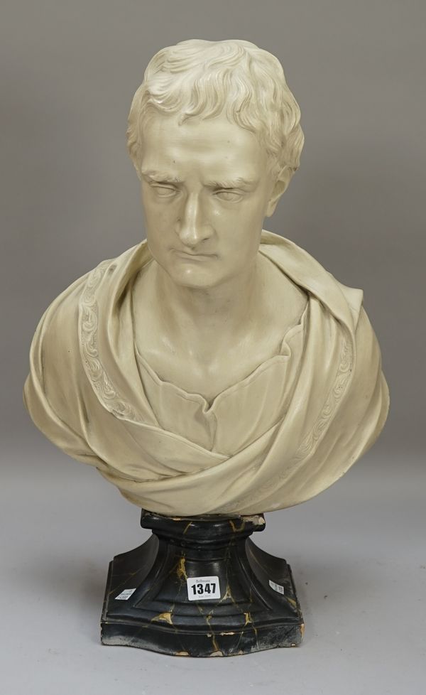 A 19th century plaster bust of a young man with draped shoulders, numbered to reverse, approx. 50.8cm x 43.2cm wide.