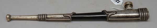 A South Asian silver mounted opium pipe, early 20th century, with ebonised tapering shaft and foliate engraved mounts, 33.5cm.