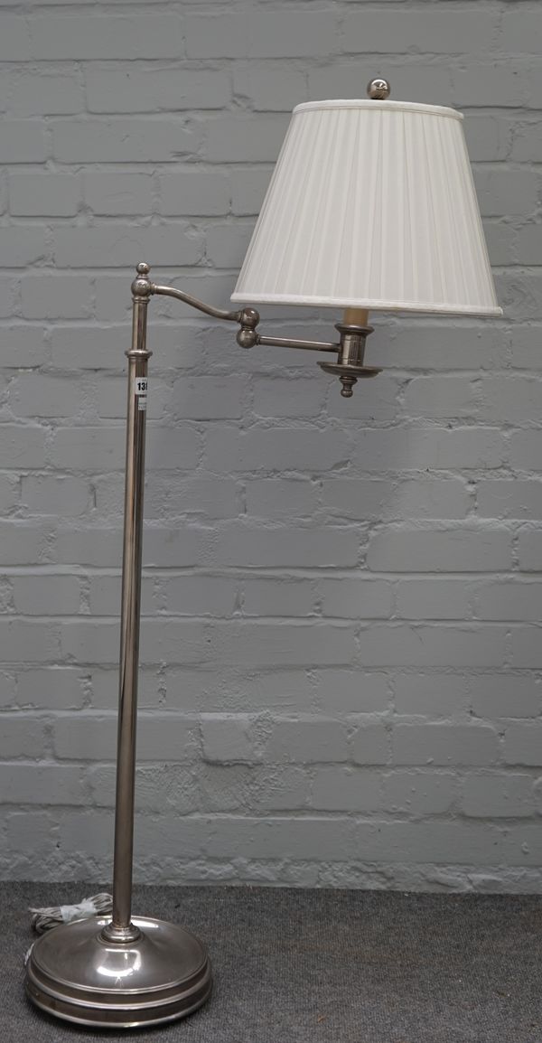 A Ralph Lauren chromed metal adjustable standard lamp with anglepoise arm, loaded circular base and a cream pleated shade, 157cm high extended.