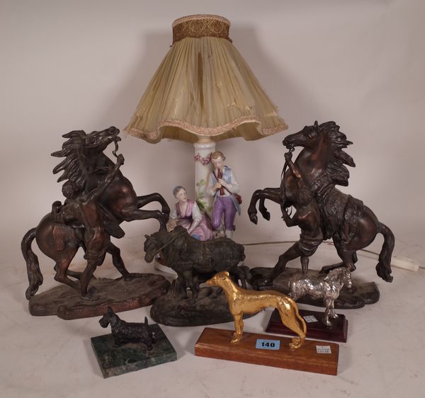 A pair of 20th century Spelter figures of Marley horses 28cm high, a Spelter figure of a horse 15cm high, a silver metal horse and two small dogs, (5)