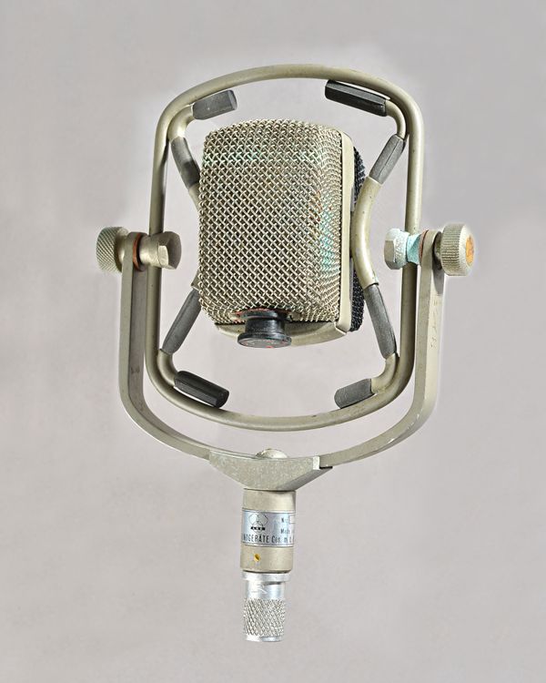 An AKG D25 dynamic microphone, c. 1960 with metal boom bracket. Illustrated Provenance: Property of the Late Ray Merrin, film re-recording sound mixer