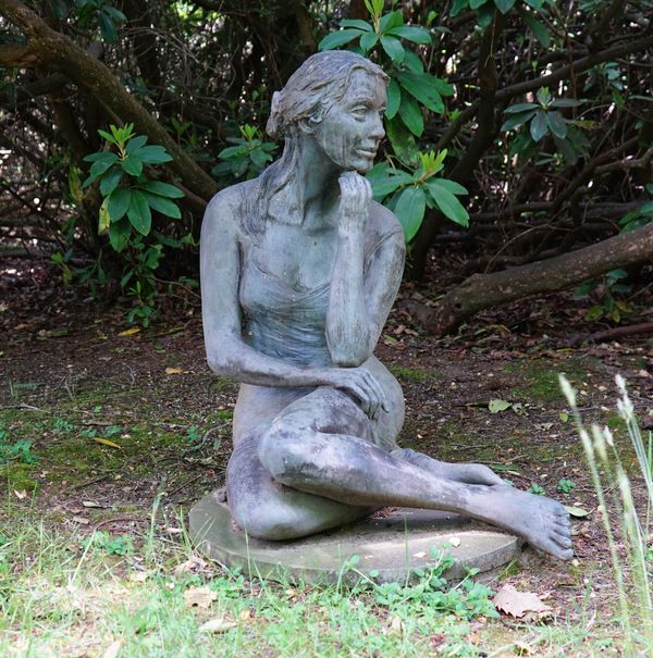 British School, 20th century, Recumbent girl, bronze, 97cm high.