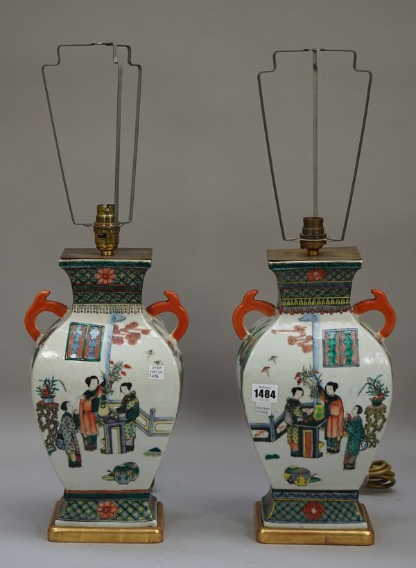 A pair of modern Chinese vase table lamps each decorated with Oriental figures, with pleated cream shades, 61cm high overall, (2).