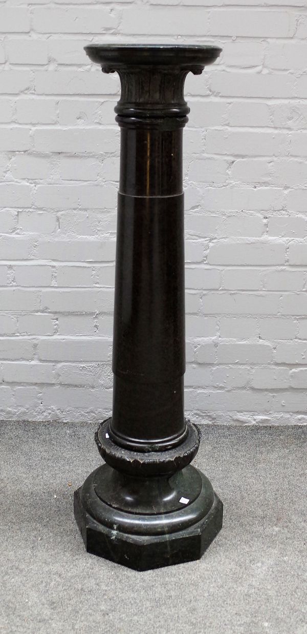 A 19th century carved serpentine column with turned body and octagonal base, 113cm high.