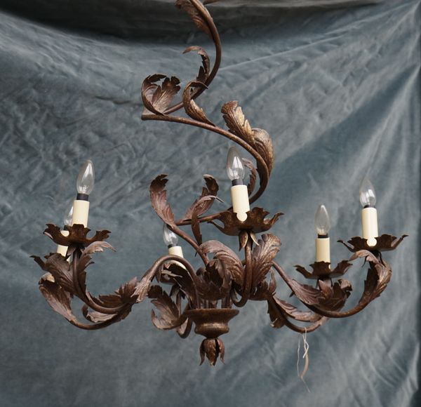 A Rococo style gilt metal six branch chandelier, modern, decorated with foliate leaves, the stem issuing six swan neck branches, 95cm high.