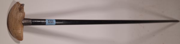 A silver topped ebonised malacca walking cane with applied whales tooth hand, London marks for 1905, 92cm.