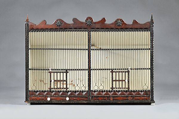 A 19th century birdcage, in the American "Tramp Art" manner, 82cms wide, 57.5cms high.  Illustrated