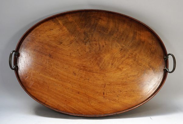 An 18th century mahogany galleried oval twin handled serving tray, 64cm wide.