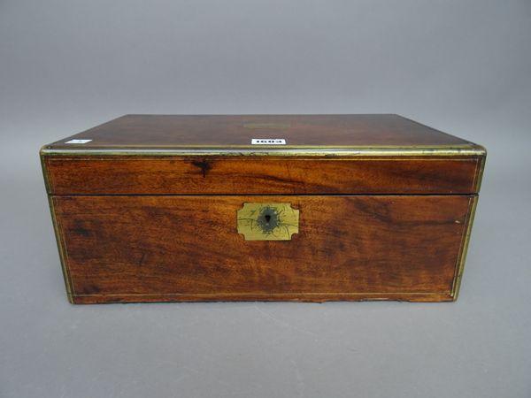 An early 19th century brass bound walnut writing slope with fitted interior, 40cm wide x 17cm high.