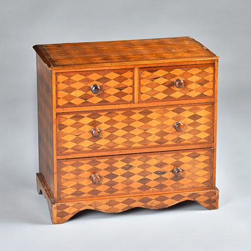 A late 18th century Continental mahogany and satinwood parquetry miniature chest, with all over lozenge parquetry (top cracked) 48cms high; 51cms wide