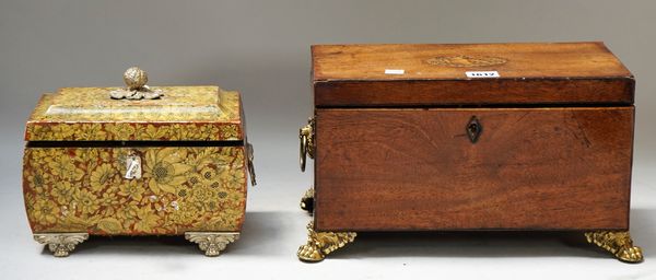 A George III mahogany rectangular tea caddy on gilt metal paw feet, 35cm wide x 19cm high; and a Regency style tea caddy of bloated sarcophagus form,