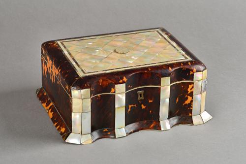 A Regency mother-of-pearl and ivory inlaid tortoiseshell sewing box, with double serpentine front and fitted interior, 28cm wide x 12cm high.