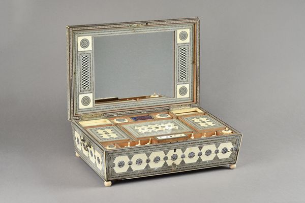 An early 19th century Sadeli ware sewing box of sarcophagus form, with fitted interior over lower drawers, fitted with writing slope, (a.f.), 43cm wid