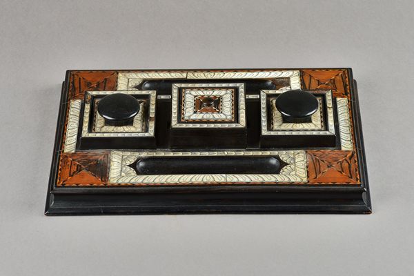 A 19th century bone and marquetry inlaid Ceylonese desk stand, with a pair of ink pots centered by box and a pair of pen trays, 39cm wide x 7cm high.