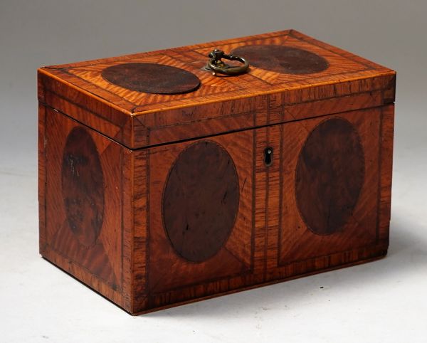 A George III satinwood and yew wood rectangular tea caddy, with twin compartment interior, 20cm wide x 13cm high.