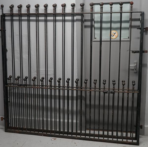 A pair of 20th century iron gates with sphere decoration, 388cm wide x 183cm high. (2)