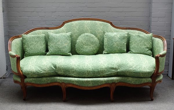 A Louise XV style beech framed canape/ sofa, with shaped back and seat on scroll supports, 216cm wide x 105cm high.