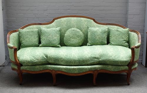 A Louise XV style beech framed canape/ sofa, with shaped back and seat on scroll supports, 216cm wide x 105cm high.
