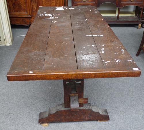 A 17th century style oak veneered plank top refectory table on trestle end standard supports, 84cm wide x 200cm long