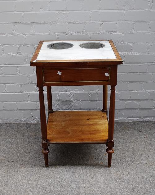 A late 18th century Directoire brass-mounted mahogany "Table de Raffraischoir", the inset Carrara marble top with two brass cylindrical wine coolers,