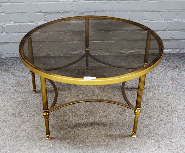 A 20th century lacquered brass circular occasional table, with inset smoked glass top on reeded supports, 76cm diameter x 41cm high.