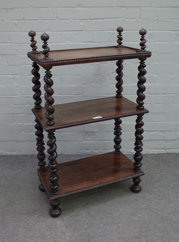 A 19th century Anglo-Indian rosewood three tier whatnot, on barleytwist supports 62cm wide x 103cm high.