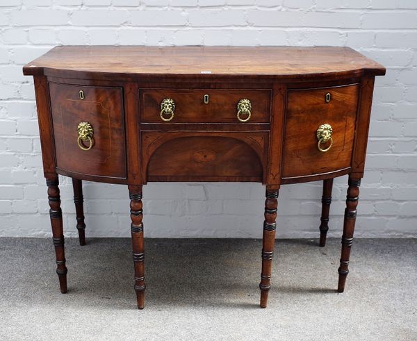 A Regency inlaid mahogany small bowfront sideboard, with four frieze drawers and turned supports, 121cm wide x 91cm high.