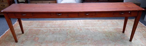 An early 19th century French fruitwood and pine serving table, with four frieze drawers, on tapering square supports, 281cm wide x 76cm high.