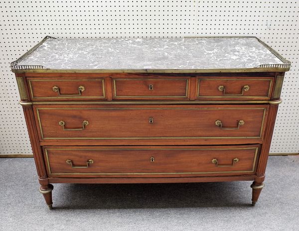 A 19th century French commode, the rectangular marble top over a gilt metal mounted mahogany three drawer base on turned supports, 126cm wide x 87cm h