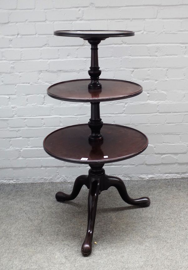 A George III mahogany circular graduated three tier dumb waiter, on tripod base, 59cm diameter x 110cm high.