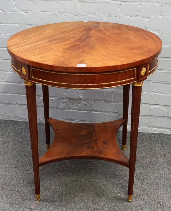 A 19th century French gilt metal mounted mahogany circular octagonal table, on tapering reeded supports united by platform undertier, 71cm diameter x