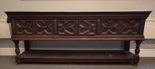 A Charles II and later oak dresser base, with three geometric moulded drawers on baluster supports united by potboard, 200cm wide x 81cm high.
