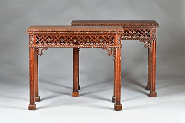 A pair of 19th century Chippendale revival mahogany card tables, each with rectangular foldover top with fret work frieze on block supports, 86cm wide