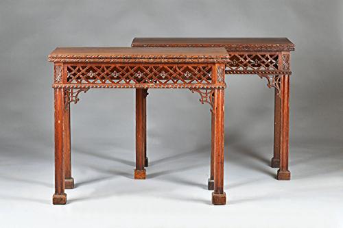 A pair of 19th century Chippendale revival mahogany card tables, each with rectangular foldover top with fret work frieze on block supports, 86cm wide