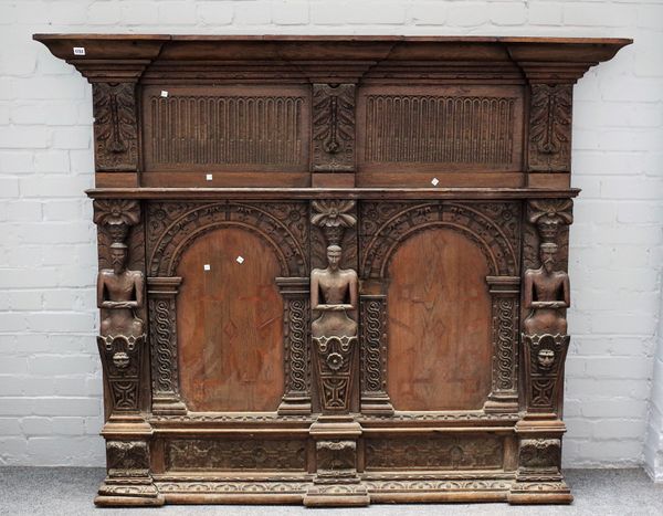 An oak overmantel incorporating 17th century elements, the two arched panels divided by figures, 177cm wide x 149cm high.