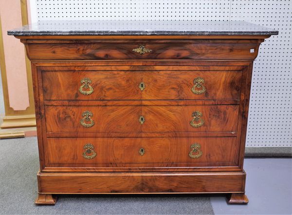 A French Directoire commode, the marble top over a walnut base of five long graduated drawers, 128cm wide x 98cm high.