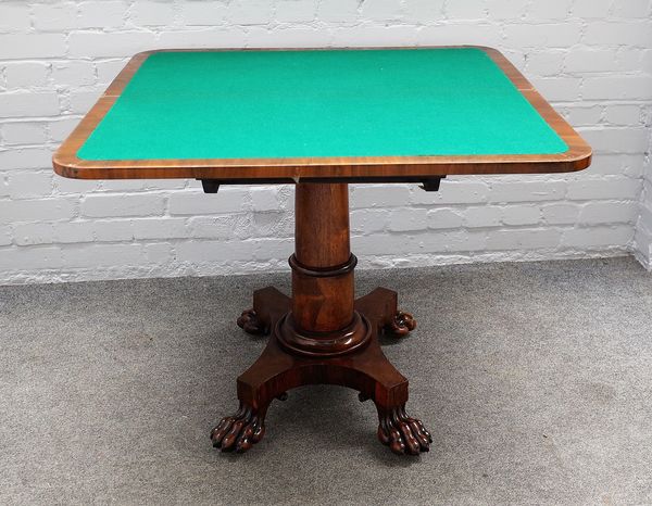 A Regency rosewood 'D' shaped card table on turned column and paw feet, 91cm wide x 74cm high.