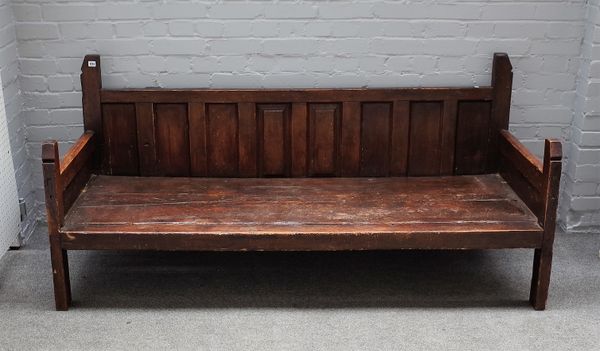 A large bench/dog bed, constructed from 18th century timber with panel back and block supports, 188cm wide x 86cm high.