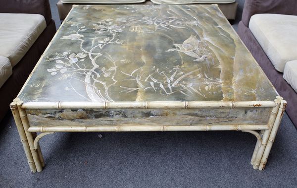 A large 20th century faux bamboo square coffee table, painted with birds in a river scene, 152cm wide x 49cm high.   38