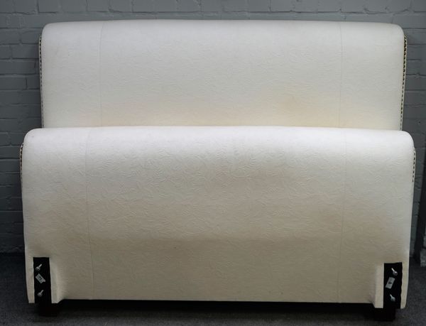 Ralph Lauren; a 20th century cream upholstered brass hobnailed double bed frame, 180cm wide x 250cm long.