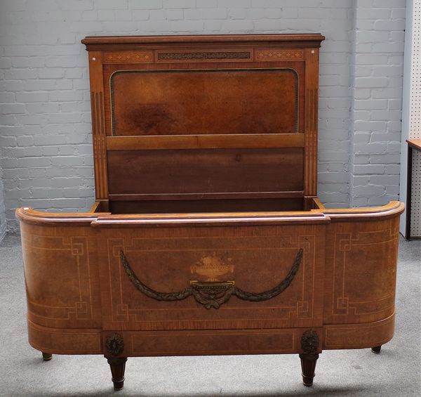 A 19th Century French walnut marquetry inlaid and ormolu mounted double bedstead, 166cm wide x 144cm high together with a matching bedside cabinet and