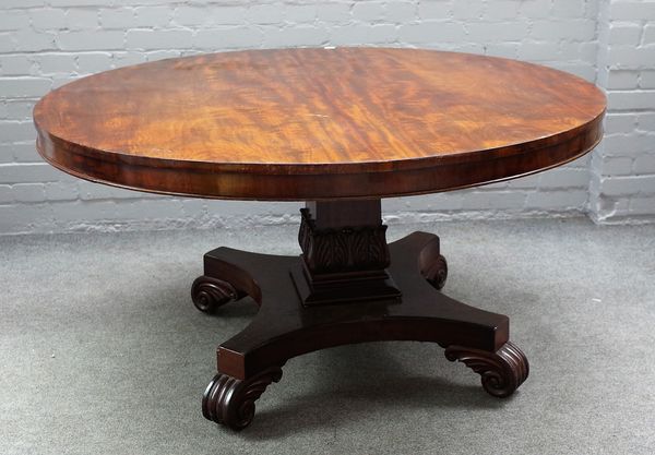 A George IV mahogany centre table, the circular snap top on quatrefoil platform and scroll feet, 139cm diameter x 73cm high.  72