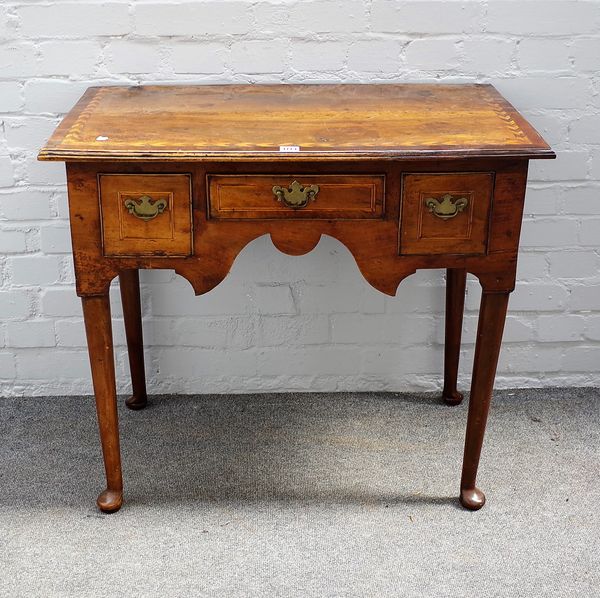 An 18th century chevron banded fruitwood lowboy with three drawers, 83cm wide x 73cm high.