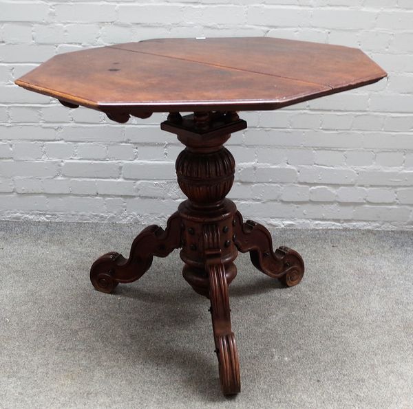 A 19th century Continental centre table, the octagonal snap top on a birdcage mount and carved tripod base, 91cm wide x 75cm high.  37