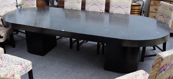 A large Art Deco style ebonised ash dining table with rounded rectangular top on a pair of pedestals, 129cm wide x 305cm long.