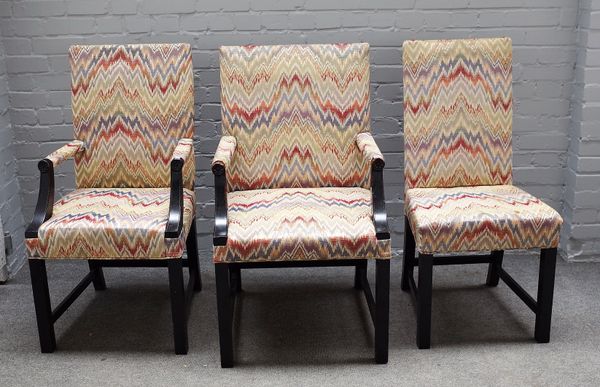 A set of fourteen ebonised square back dining chairs on block supports, (includes four carvers and ten singles), (14).