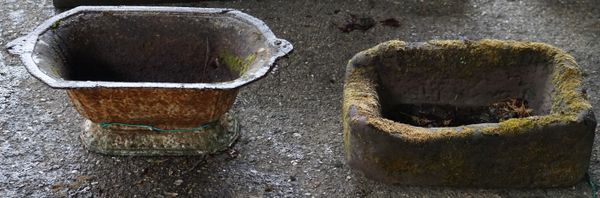 A 20th century wrought iron balustrade panel, 188cm wide, a small carved stone trough and a 19th century cast iron planter. (3)